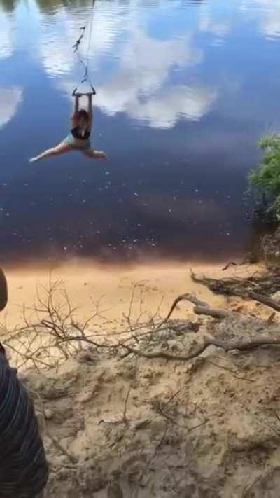 Swinging in front of a tree