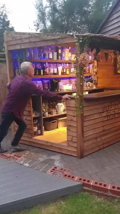 This easily-closable homemade backyard pub in the UK.