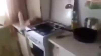 Russian guy throws water on hot oil