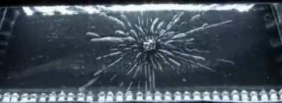 A small piece of Uranium, sitting in a cloud chamber, that shows radiation emissions