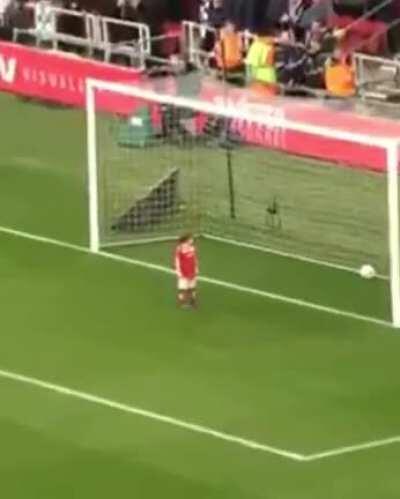 Kid Steals Ball Before English football Match, Scores Goal, Stares Down The Crowd