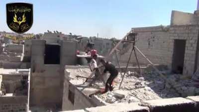 Syrian rebels use a crude trebuchet to launch burning pitch towards government positions - Damascus 2013