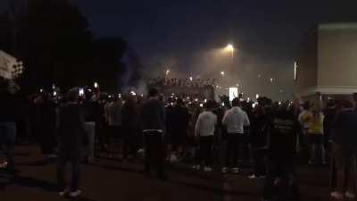 Players Celebrate on Open Top Bus Outside Elland Road