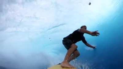 This surfer takes us into a twenty-foot barrel and it's maybe the closest we can get to surfing-nirvana without getting wet