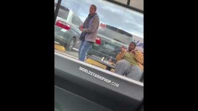 Guy pranks people at bus stop with a fake gun