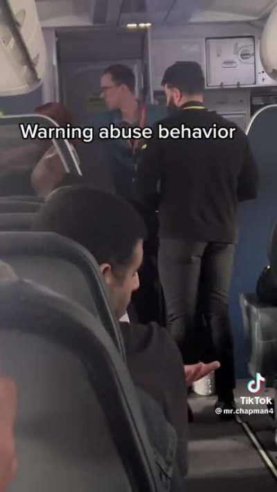 Abusing staff inside airplane
