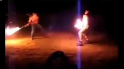 Flaming sword fight that looks like something out of starwars