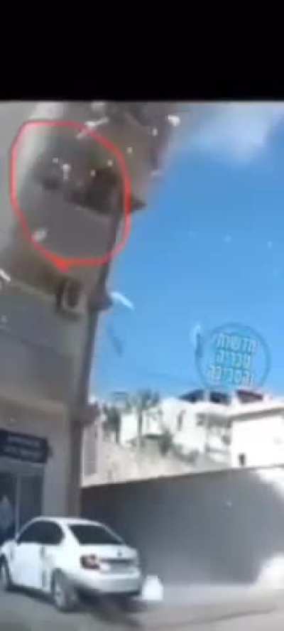 People film interceptions from their balcony, rocket/sharpnel hits their building. Northern Israel, October 2024.