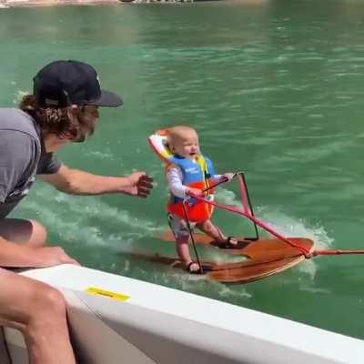 This toddler water skiing