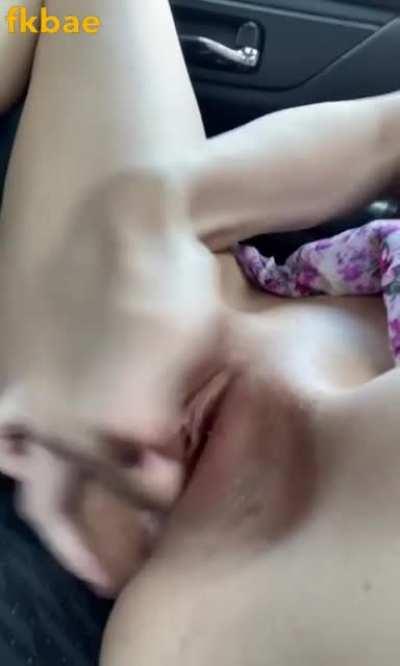 College girl filming herself getting naked in car and fingering her pussy hard