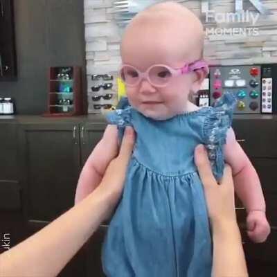 Baby girl sees Mom for the first time after wearing glasses