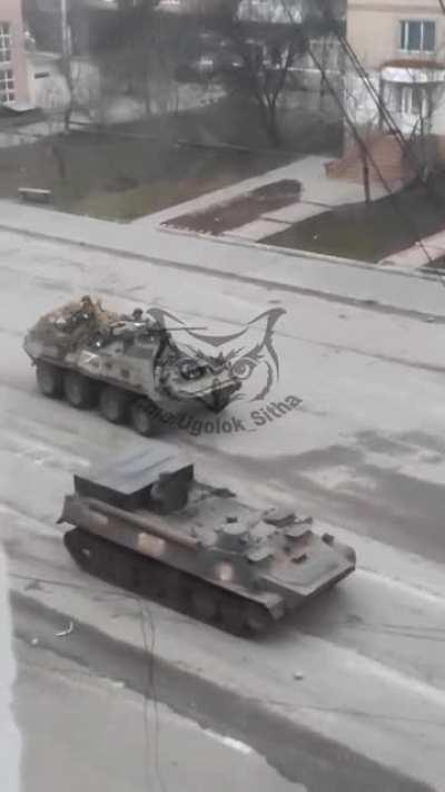 Russian TOS-1 and BTRs in the streets of Tokmak