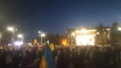 Ukraine citizens in the Donetsk wave their flag and sing the national anthem before the Russia war