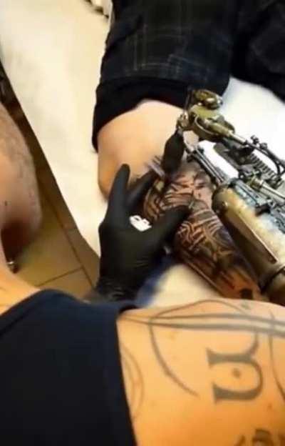 French artist JC Sheitan Tenet and his steampunk-style tattoo machine prosthesis