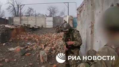 Russian soldier gets his bell rung by a snipers bullet ricocheting off his helmet