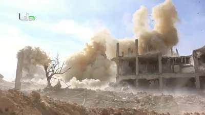 Syrian reporter films as “barrel bombs” land all around him. Darayya, Syria. 2016