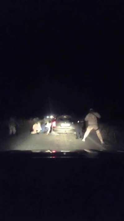 (Alleged) Ukrainian security forces (National Guard? Azov? Volunteers) stop a car and bring down everyone, outside of Mariupol