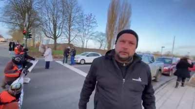 &quot;Activists&quot; block a road in Germany. Man freaks out because he has to go to work.