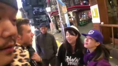 The lady in black was being followed by someone she didn't know, she stumbled on JakenbakeLIVE streaming by luck and pretended to be his friend, he picked up on it fast and played the part. This is how you hero.