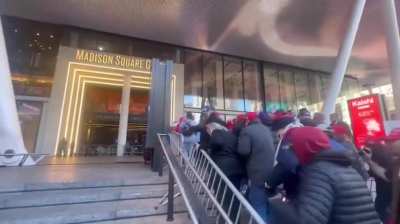 MAGA rush the entrance to MSG ahead of Trump's rally