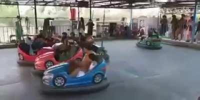 More Taliban in the amusement park. You can see some armed here