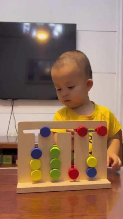 Kid solving a color grouping puzzle