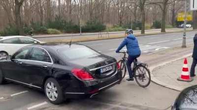 New German Minister of Agriculture riding his bicycle to the ceremonial swearing-in