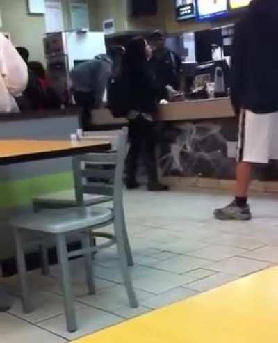 McDonald's cashier in Greenwich hits two customers with a stick after they slap him and jump the counter.
