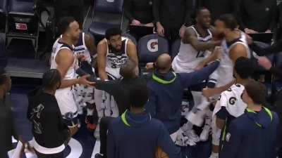 Rudy Gobert of the Minnesota Timberwolves throws a punch at his own teammate before being sent home by his team