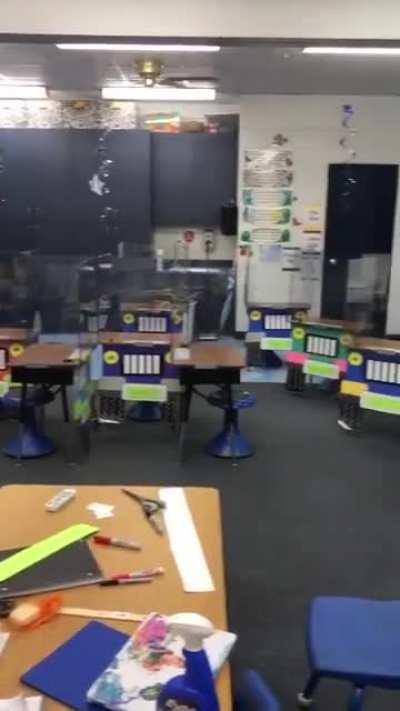 A first grade teacher didn't want her classroom to look scary to children because of the dividers so she did this...