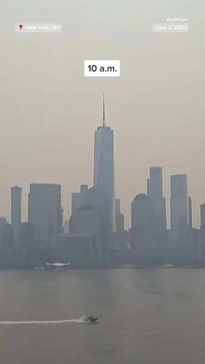 Time lapse of the New York City skyline with smoke coming in