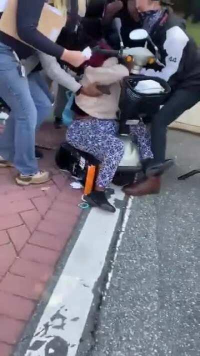 Police pepper spray people, including children, marching to the polls in Alamance County, North Carolina. Several of the children vomited; a woman is seen falling out of a wheelchair. Many of the the voters were ultimately turned away from the polls.