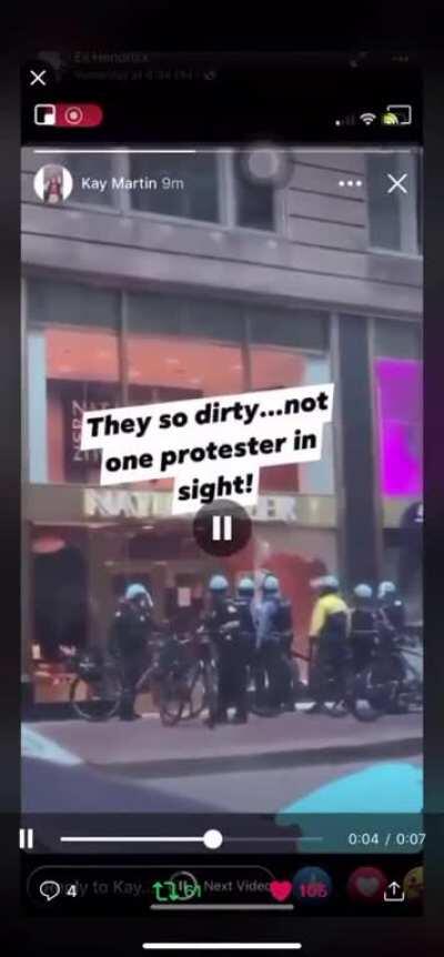 Cops smashing windows of buildings