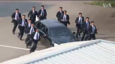 Kim Jong-un's bodyguards protecting his limo