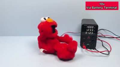 An Elmo toy under high voltage 