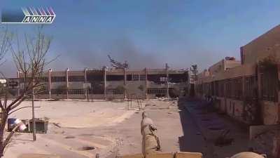 Assad regime T-72 has close call with incoming RPG round in school courtyard. Our friend Hussein returns accurate fire (Syria, no date).