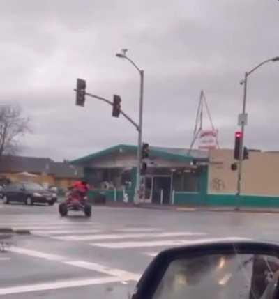 ATV rider shuts down an intersection in Oakland California