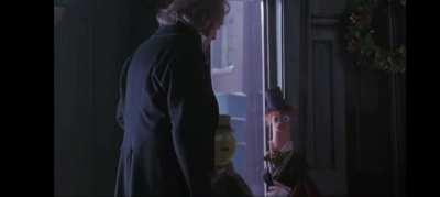 I was watching the muppets Christmas Carol and I just noticed that beaker gives scrooge the finger!