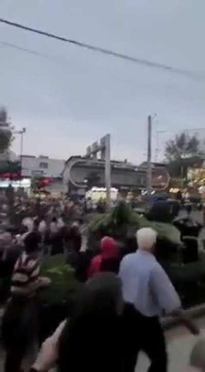 In the city of Amol in Northern Iran, Iranians are protesting the death of a 22 year old woman by the 'morality police' and defying the riot police, who are trying to run away.