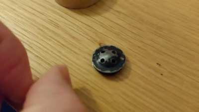 These are the buttons from a WW2 RAF uniform. When you put them together, they make a mini-compass, for use if you get shot down behind enemy lines.