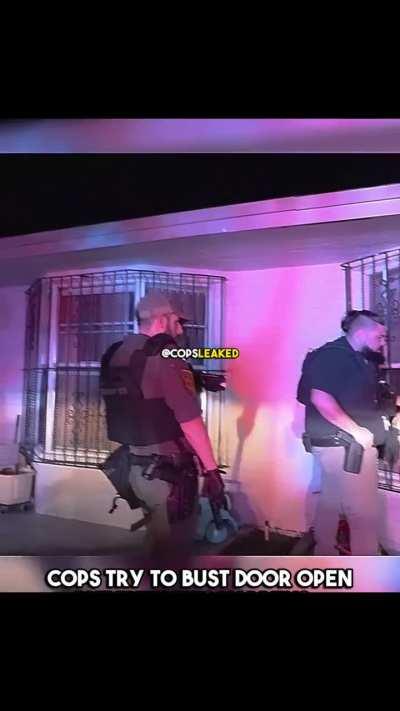 Cops try to bust open a door (great video)