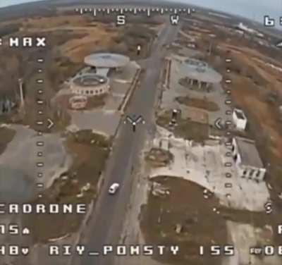 A Russian vehicle unsuccesssfully attempts to flee from a Ukrainian FPV drone, rolling over before being hit.