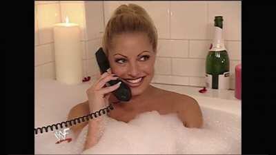 Trish stratus in a hot tub on the phone to Vince