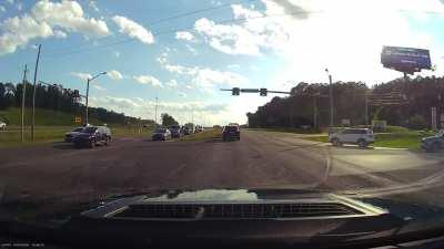 Guy not paying attention makes a blind left turn into oncoming traffic [OC]