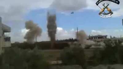 Opposition IED detonation lifts both the road and the Syrian Army tank on it - 2012