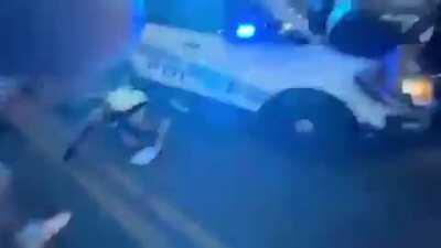 Detroit police officer drives through a crowd of protesters, hitting the gas, stopping and speeding forward. Multiple injuries reported.