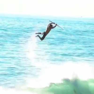 This Surfer using a wave like a quarter pipe.