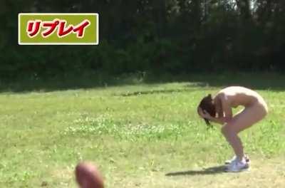 Naked Japanese women attempt to catch a football.