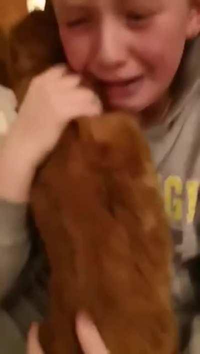 This kid's reaction to being reunited with their cat after it had been lost for 7 months