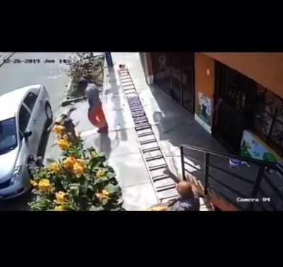 Man in wheelchair shakes a painters ladder because it was blocking the pavement